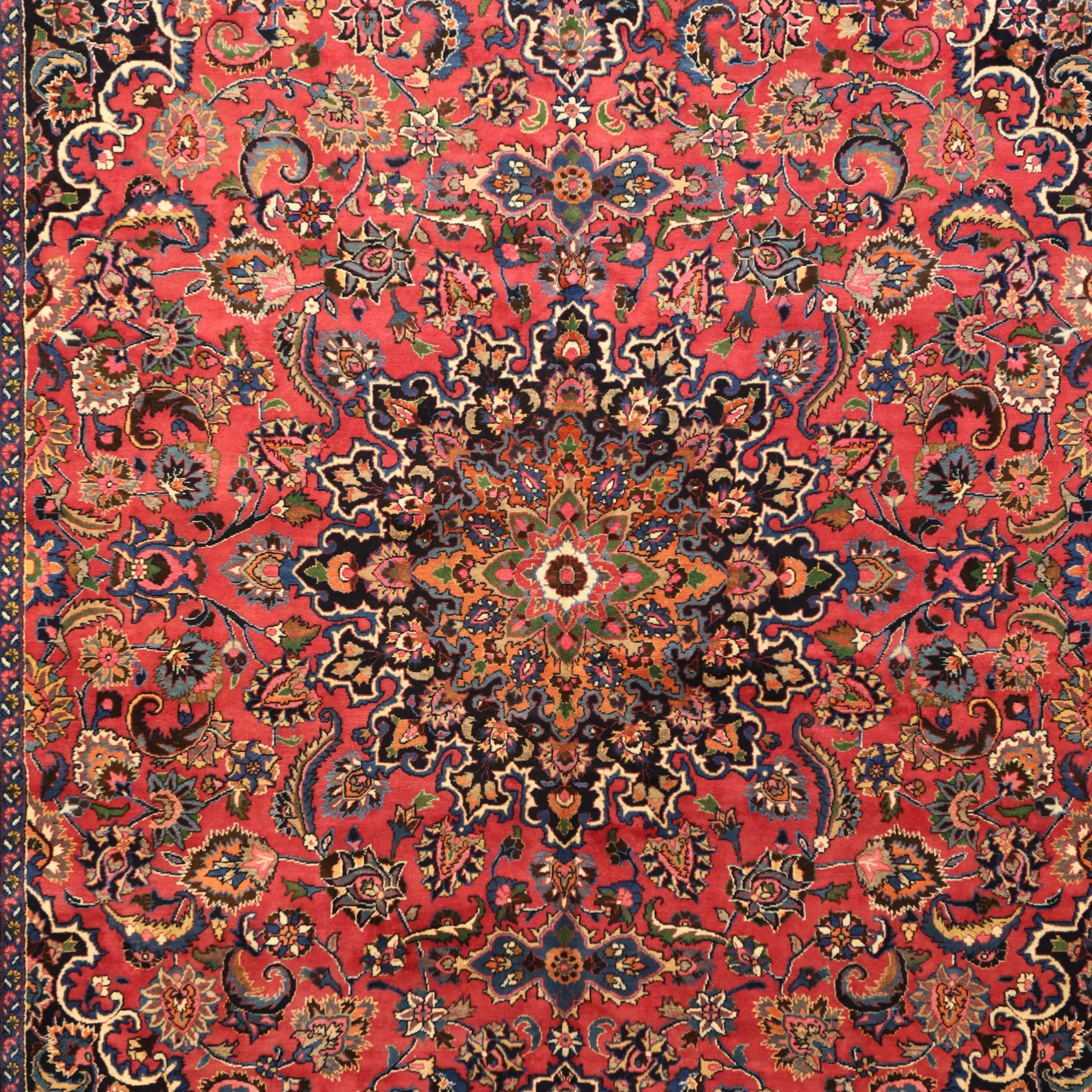 10'2" x 13'0" RED AND NAVY MASHAD FLORAL PERSIAN RUG
