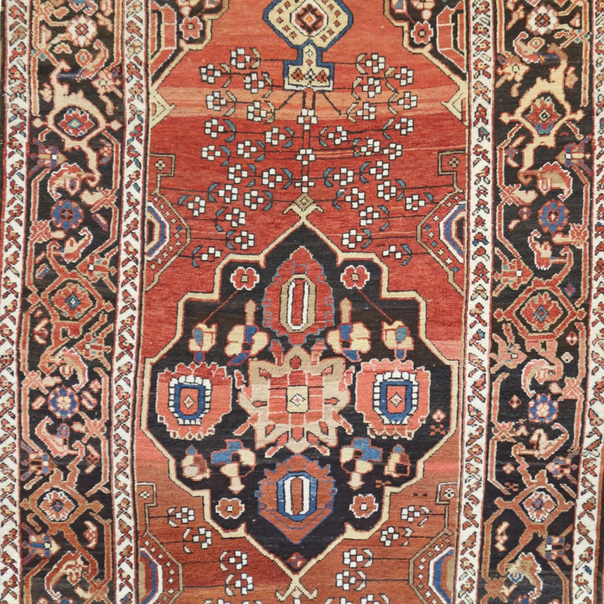 4'3" x 6'10" RUST AND BROWN BAKHTIARI ANTIQUE PERSIAN RUG
