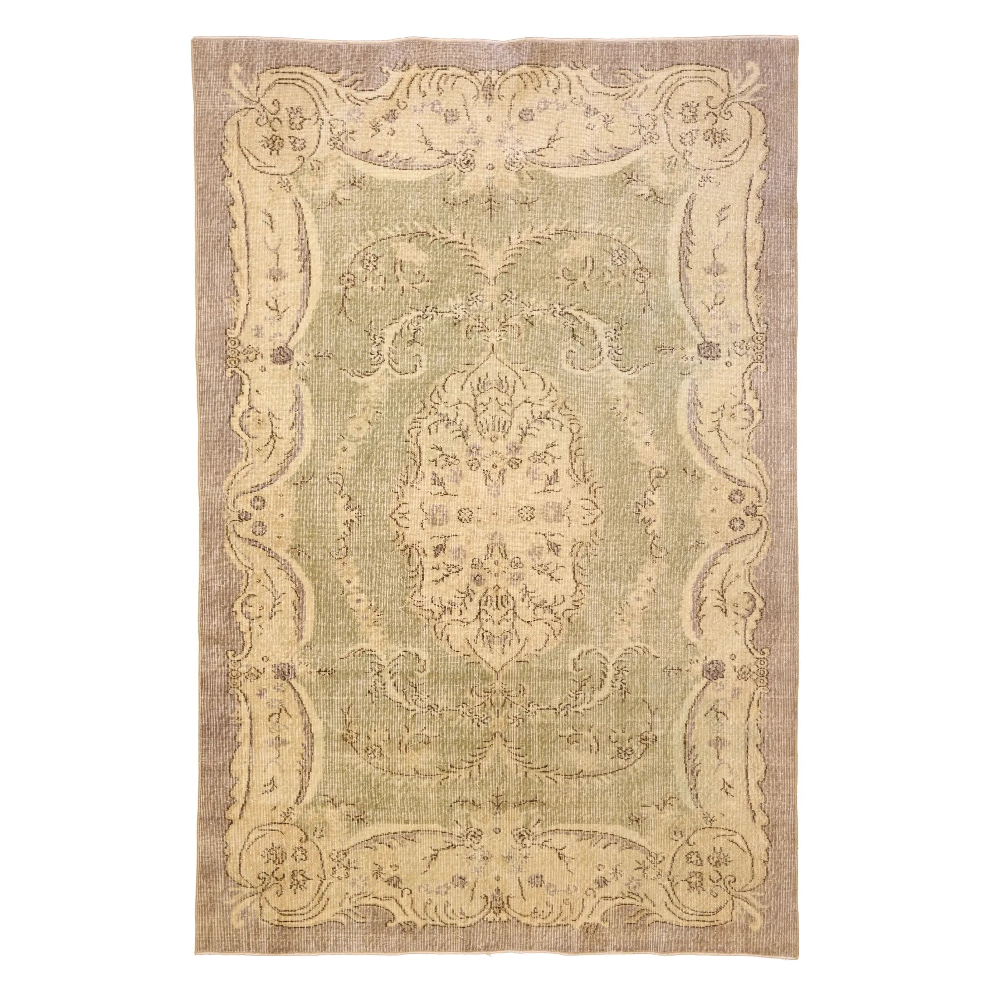 5' 10" x 8' 10" GREEN AND TAN SPARTA FLORAL TURKISH RUG