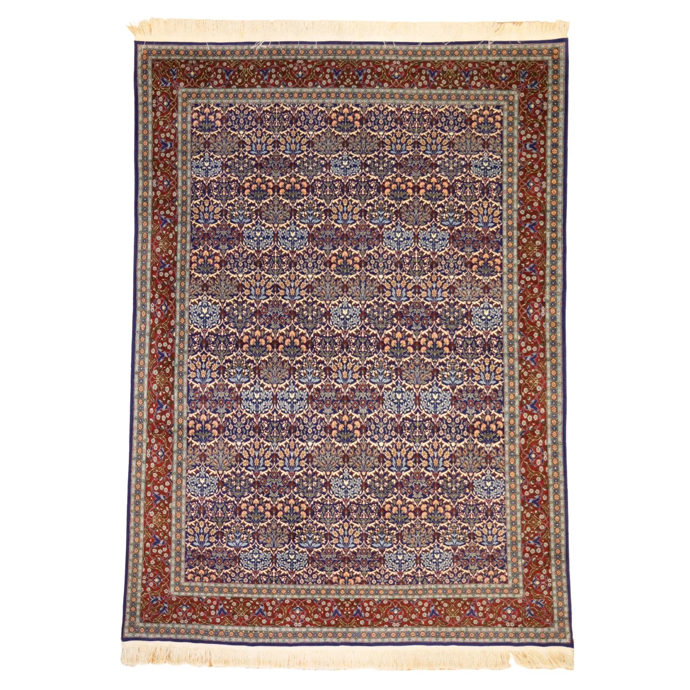 7'7" x 10'7" BLUE AND RED HEREKE TURKISH ALL-OVER RUG