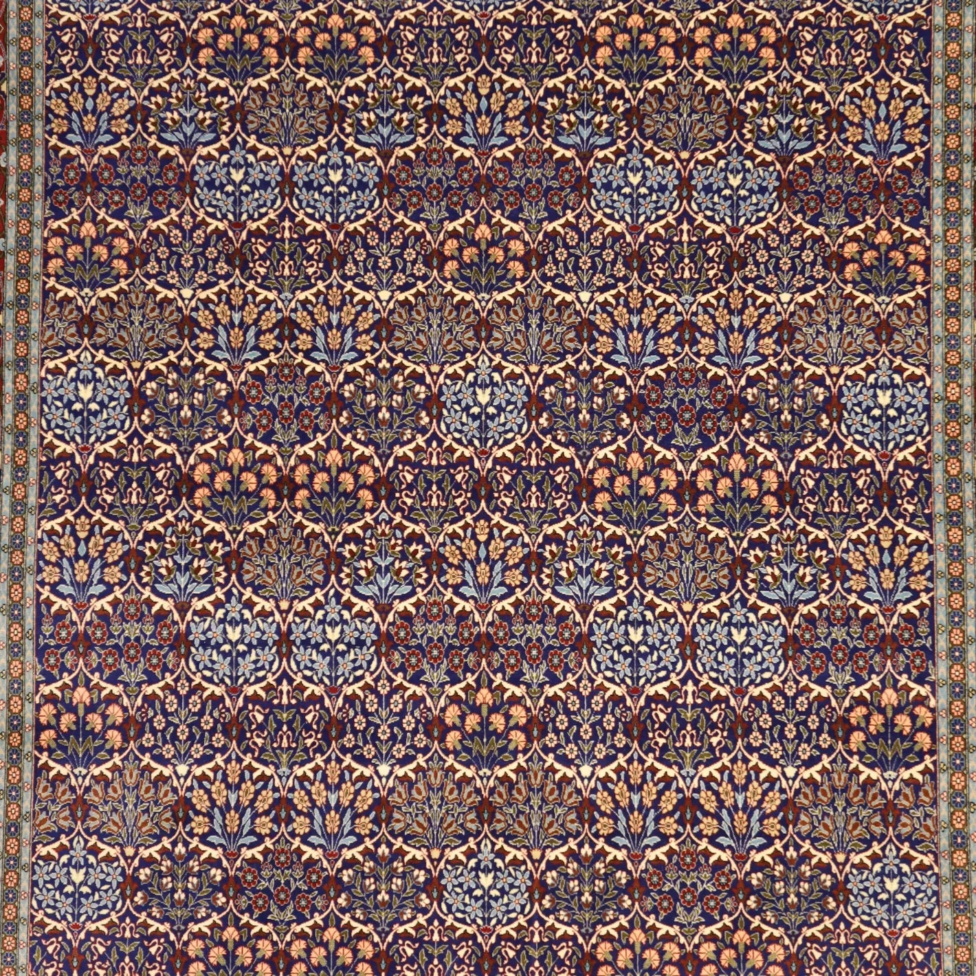 7'7" x 10'7" BLUE AND RED HEREKE TURKISH ALL-OVER RUG