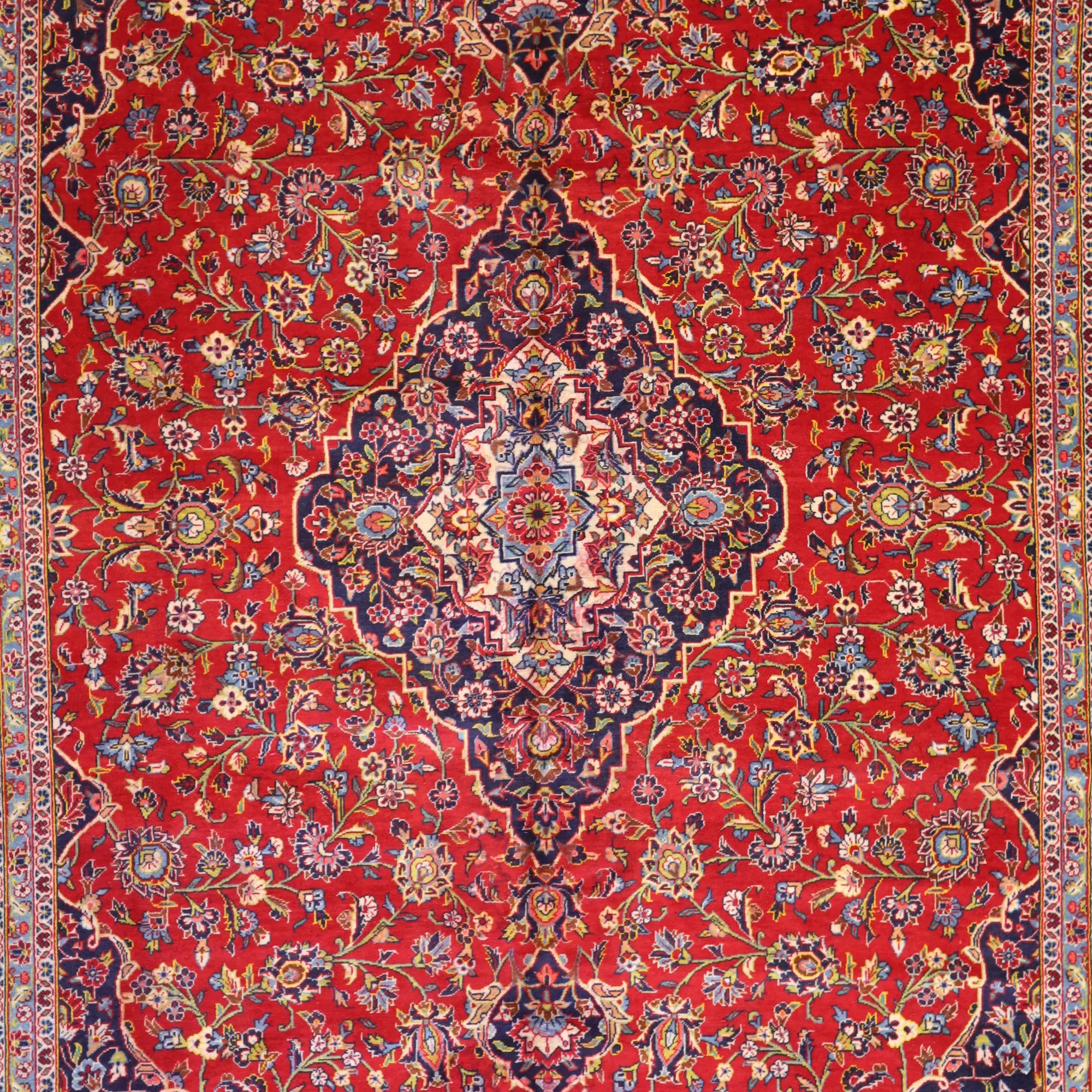 9'8" x 14'7" RED AND NAVY KASHAN FLORAL PERSIAN RUG